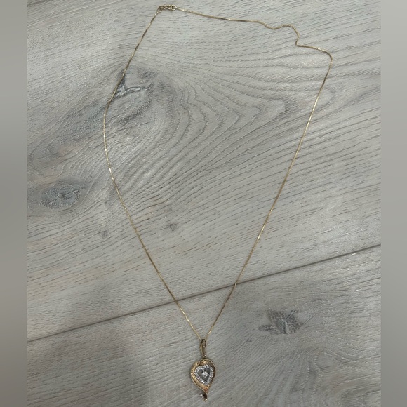 14 karat yellow gold necklace with diamond fancy open heart pendant